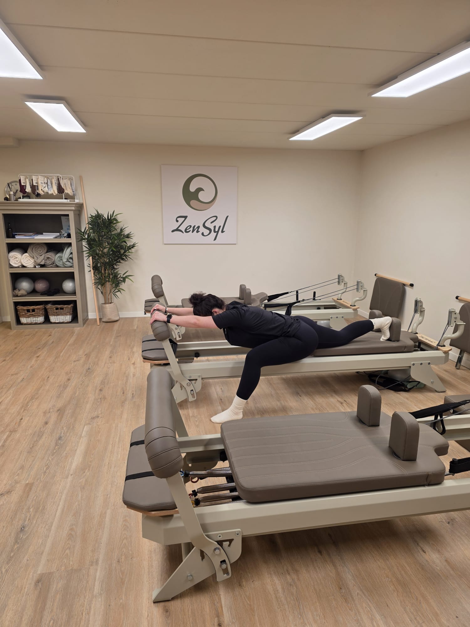 Stretch- en core-oefening op de reformer